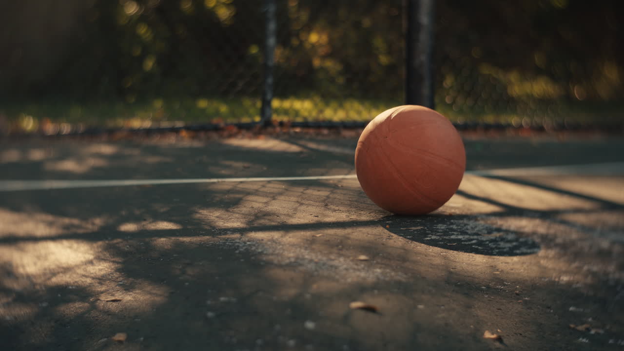 Orange Basketball on an Outdoor Court