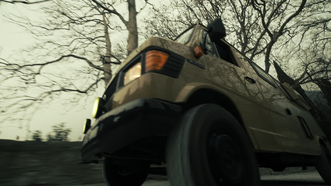 Vintage Van Driving Through Scenic Landscape