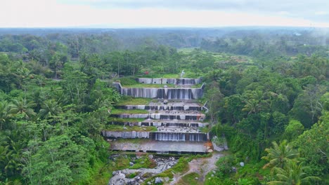 iconic watu purbo waterfall in indonesia, aerial drone view