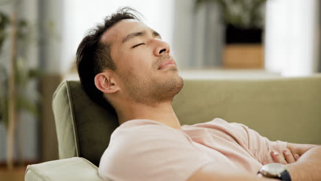 man sleeping on a couch