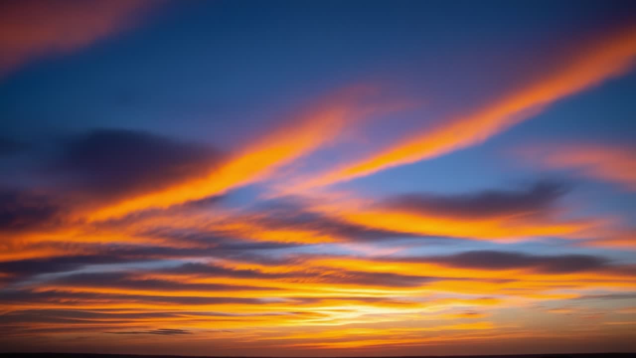 Vibrant Sunset Sky with Streaky Orange Clouds