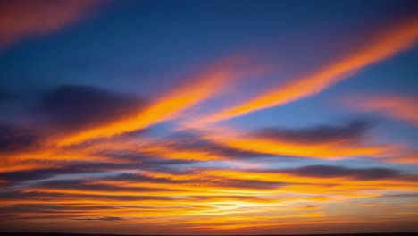 vibrant sunset sky with streaky orange clouds