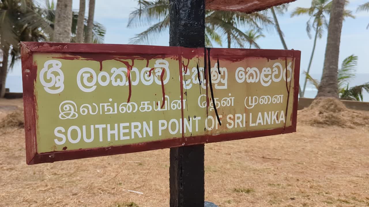 Sign for southern point of Sri Lanka at Dondra Head lighthouse in English, Tamil, and Sinhala languages