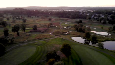 4k drone over foggy golf course