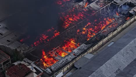 Warehouse-on-fire-and-black-smoke