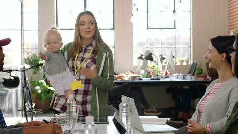 business woman, mother and speaker with a baby