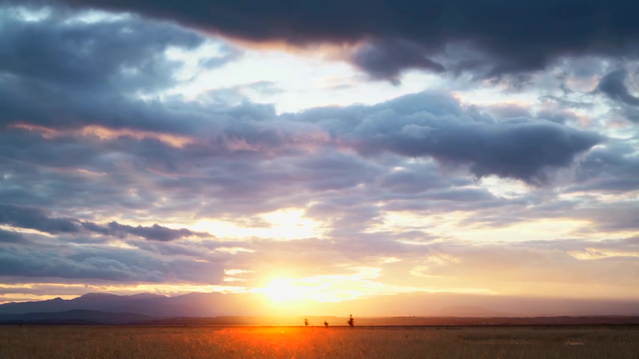 Time Lapse of Dramatic Sunset Over Mountain Landscape