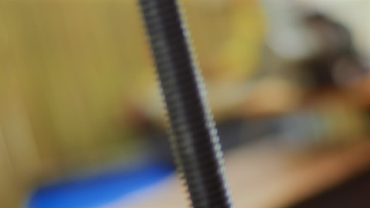 The fruit farmer rotates the press by hand while pressing the apples into fruit must