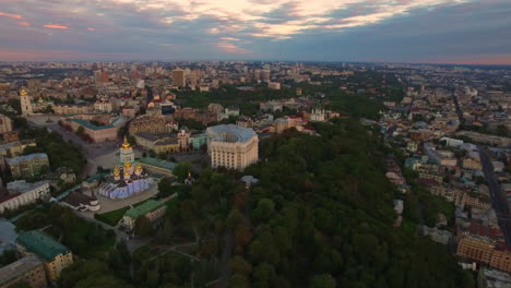 Aerial-view-modern-city-architecture-on-evening-sunset-landscape