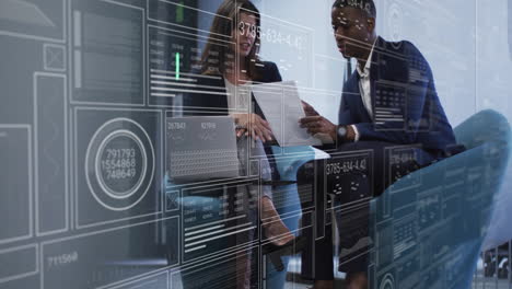 animation of data processing over diverse male and female business colleague talking