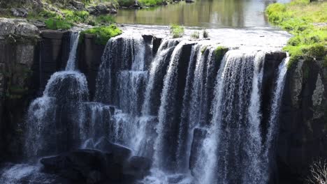 water cascading down a scenic cliffside waterfall