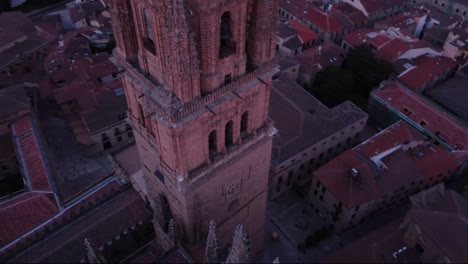 close up aerial view of the tower of salamanca cathedral and cityscape in the early morning light