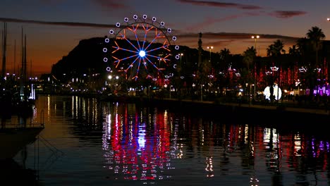 ferris wheel turning at sunset.time lapse.