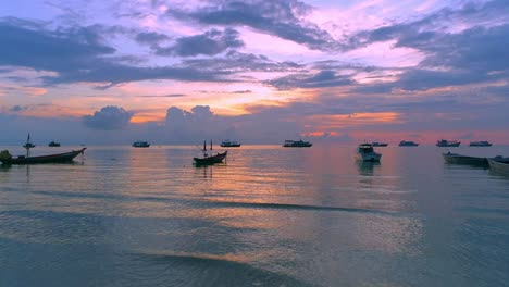 beautiful sunset over the ocean with boats