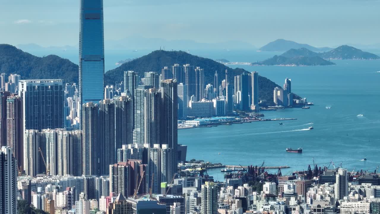 4K Tele zoom view of Hong Kong central district - slow pan aerial view angle from sky.