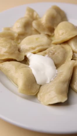 pierogi with sour cream