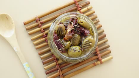 jar of green olives with sun dried tomatoes