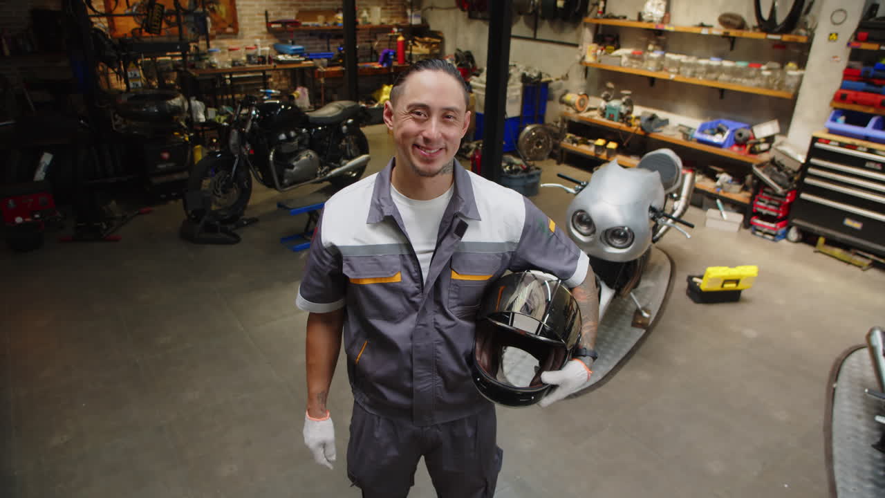 Portrait of Multicultural Mechanic Working in Motorcycle Repairing Center