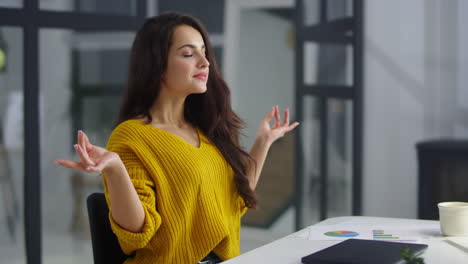 Happy-business-woman-finishing-work-on-laptop-indoor