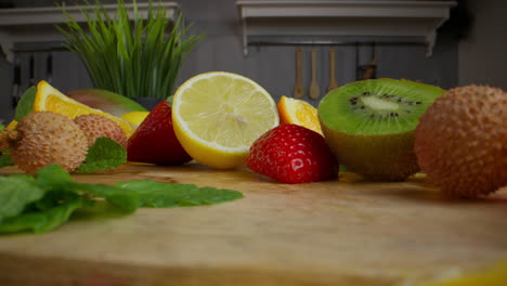 assortment of fresh fruits on wooden cutting board