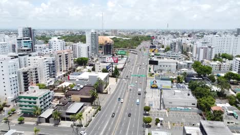 Santo-Domingo,-Dominican-Republic--May-2023---View-from-a-drone-over-the-streets-with-some-buildings-around