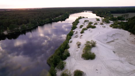 Aerial-view-of-big-river-near-the-dunes-and-forest