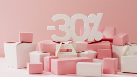 Minus-thirty-per-cent-text-in-white-with-pink-and-white-gift-boxes-on-pink-background