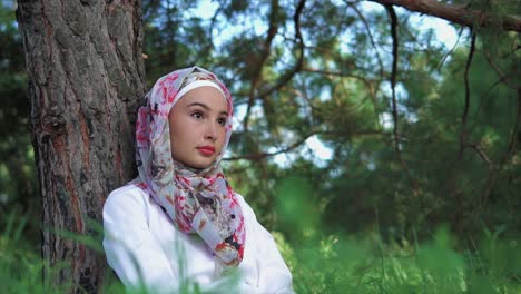young muslim woman in a park
