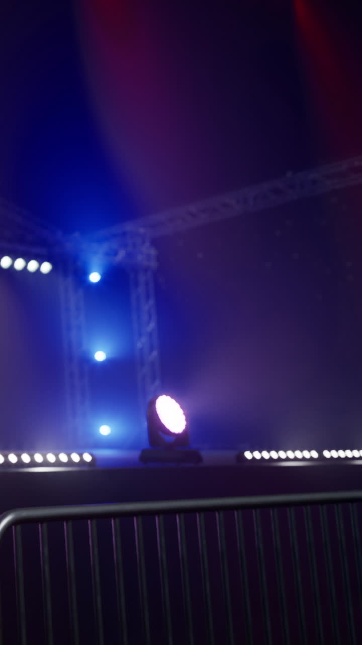 Stage setup with lights and fog during event preparation in a venue