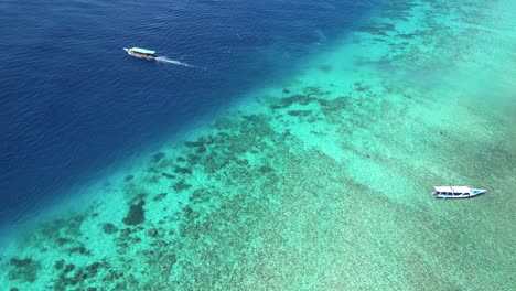 aerial-looking-down-of-two-shades-of-blue-water-sea-in-the-Indonesian-Islands