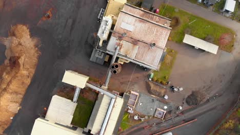 ascending top-view over a heating plant in a small town