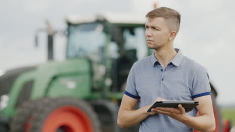 A-Young-Tractor-Driver-Uses-A-Tablet-1