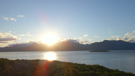 stunning sunset behind a mountain on lake te anau in new zealand