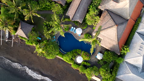 above view of swimming pool on the hotel resorts in amed, indonesia. aerial shot