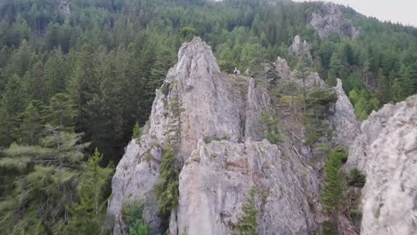 an uphill flight with a fpv drone approaching a giant rock