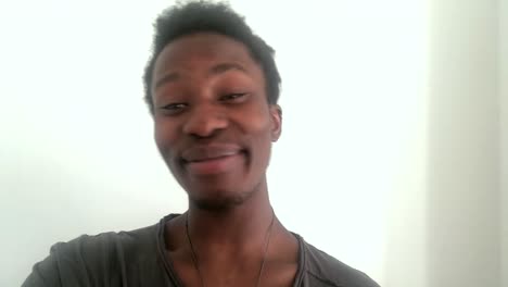man listening and responding over video call