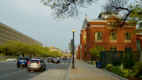 the shot pans left from the smithsonian castle to the department of energy across independence avenue in washington dc