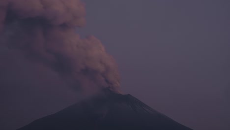 timelapse video of a volcano exhaling smoke early in the morning