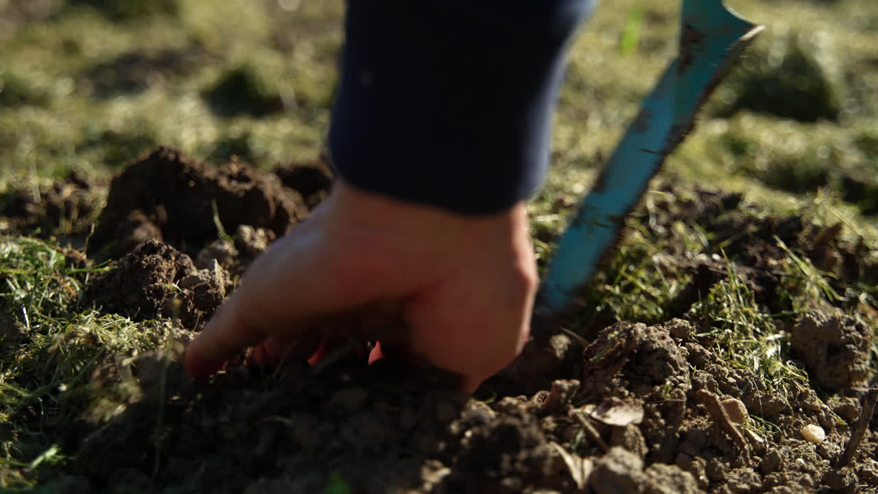Slow-Motion of a woman doing garden work