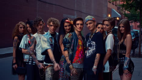 a diverse group of stylish young adults posing in an urban setting