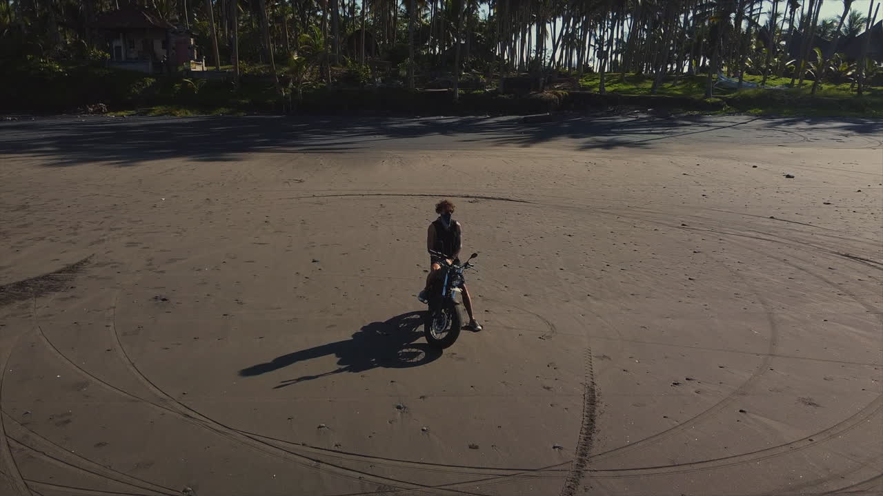 Motorcycle Adventure on a Black Sand Beach