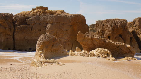 Rock-Formations-At-Praia-do-Evaristo-Beach-In-Algarve,-Portugal---wide