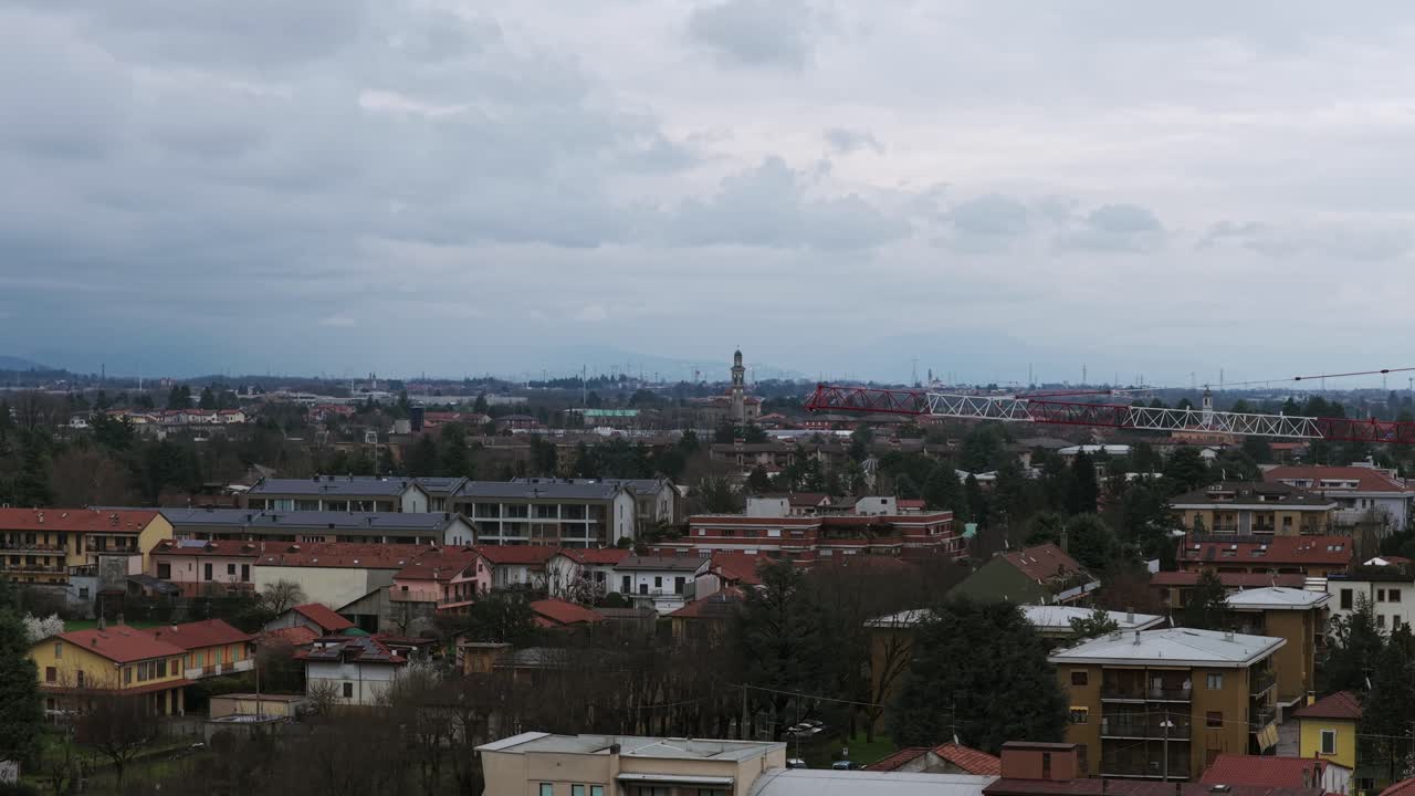 Vimercate town on cloudy day, Lombardy, Italy. Aerial drone view, copy space