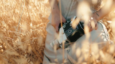 in a field with a camera