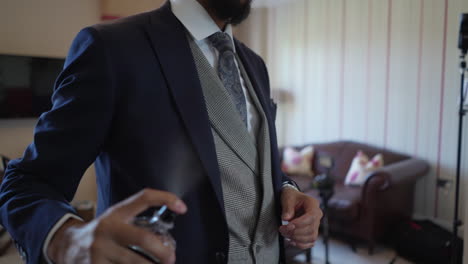 a perfume spray by a groom that is getting ready for the vanue