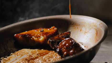 sautéing sweet potatoes in a sweet brown sauce in slow motion