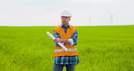 Male-Engineer-Working-While-Holding-Blueprint-19