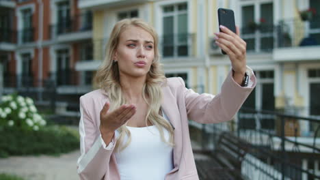 closeup businesswoman walking with phone . woman using video call on phone