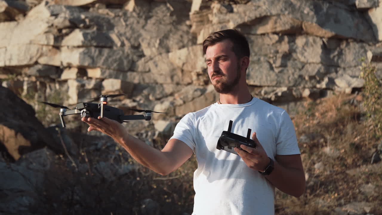 Man flying a drone in a quarry