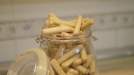 A-shot-of-a-mason-jar-overflowing-with-breadsticks